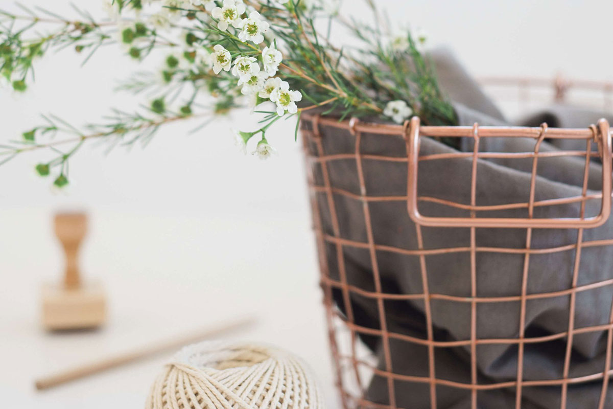 copper basket with flowers and wool